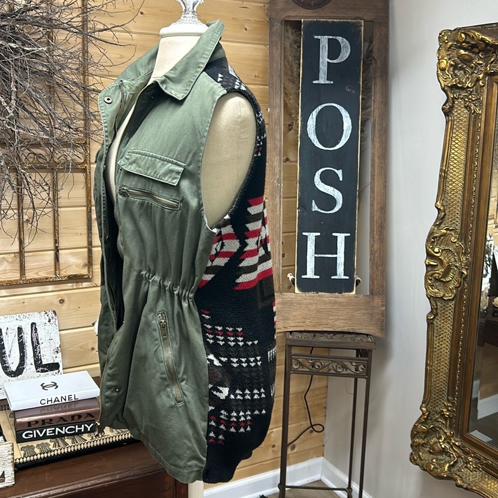 Army green vest with Aztec print at back